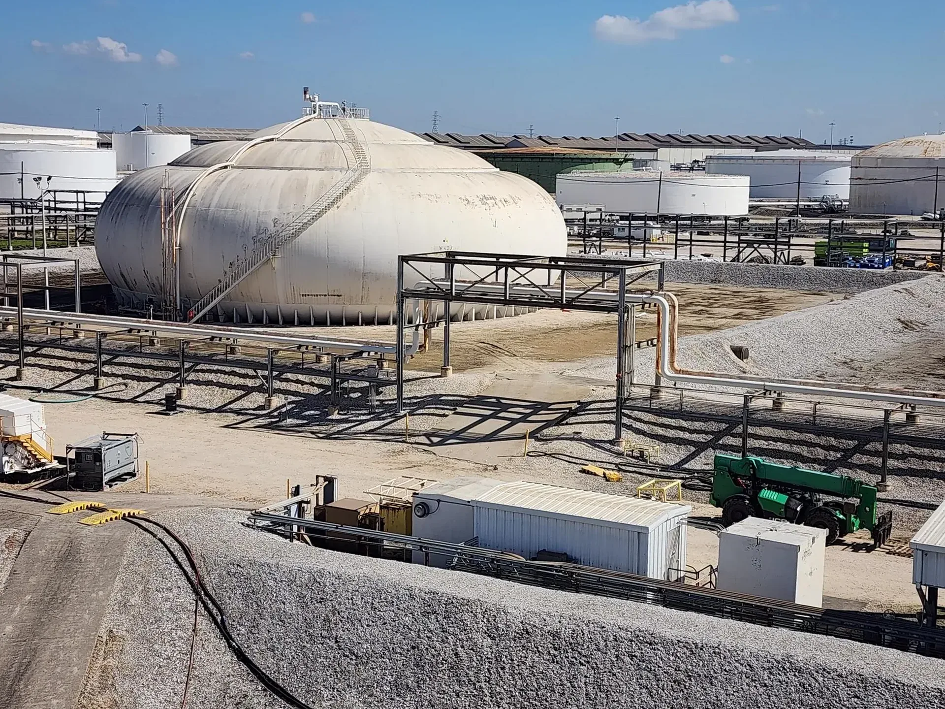 Crew cleaning an above-ground storage tank at a terminal