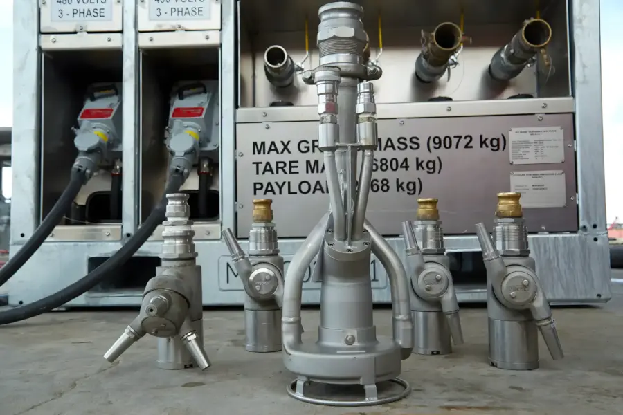 MudHog unit with its wash nozzles and hose connections laid out in front